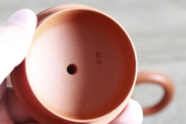 Lid of Zhou Guizhen - Yixing Zisha Teapot Master on the Hand