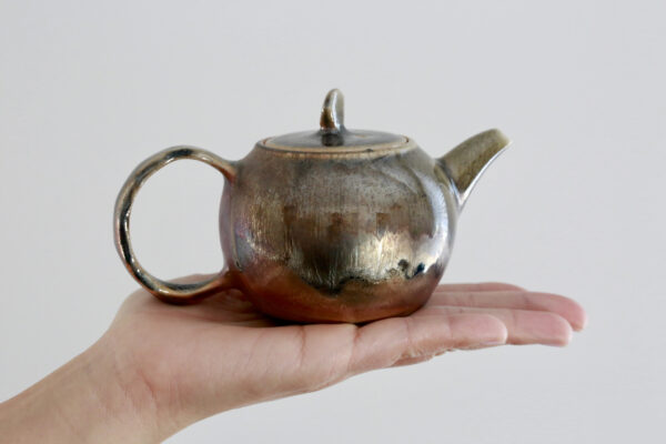 Glazed Teapot - Wood Fired & Handmade Teapot on top of hand