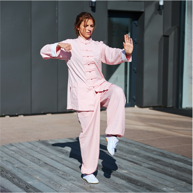 A woman in a pink tai chi uniform.